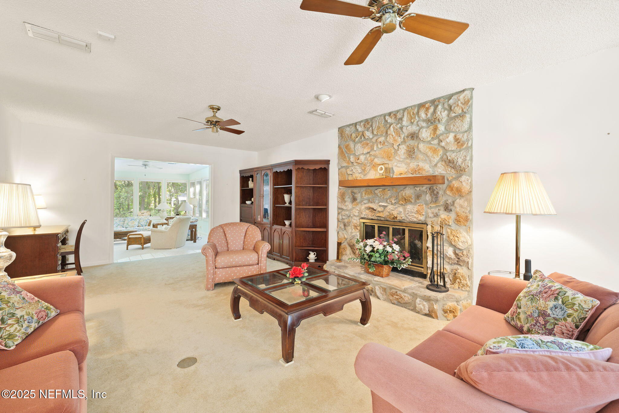 3007 Holly Road Orange Park, FL 32065 - Photo 16 of 44 a living room with furniture a table and a large window