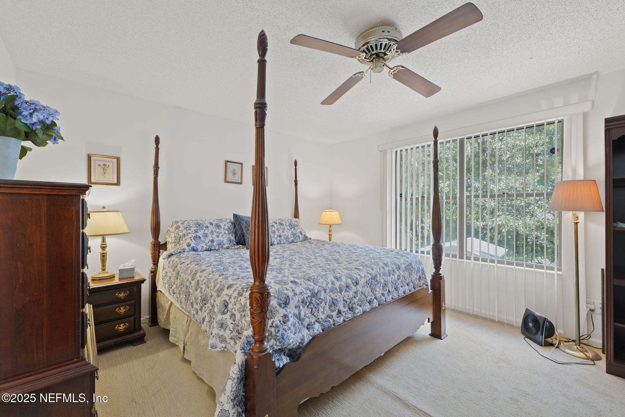 3007 Holly Road Orange Park, FL 32065 - Photo 24 of 44 a bed room with a bed and a chandelier