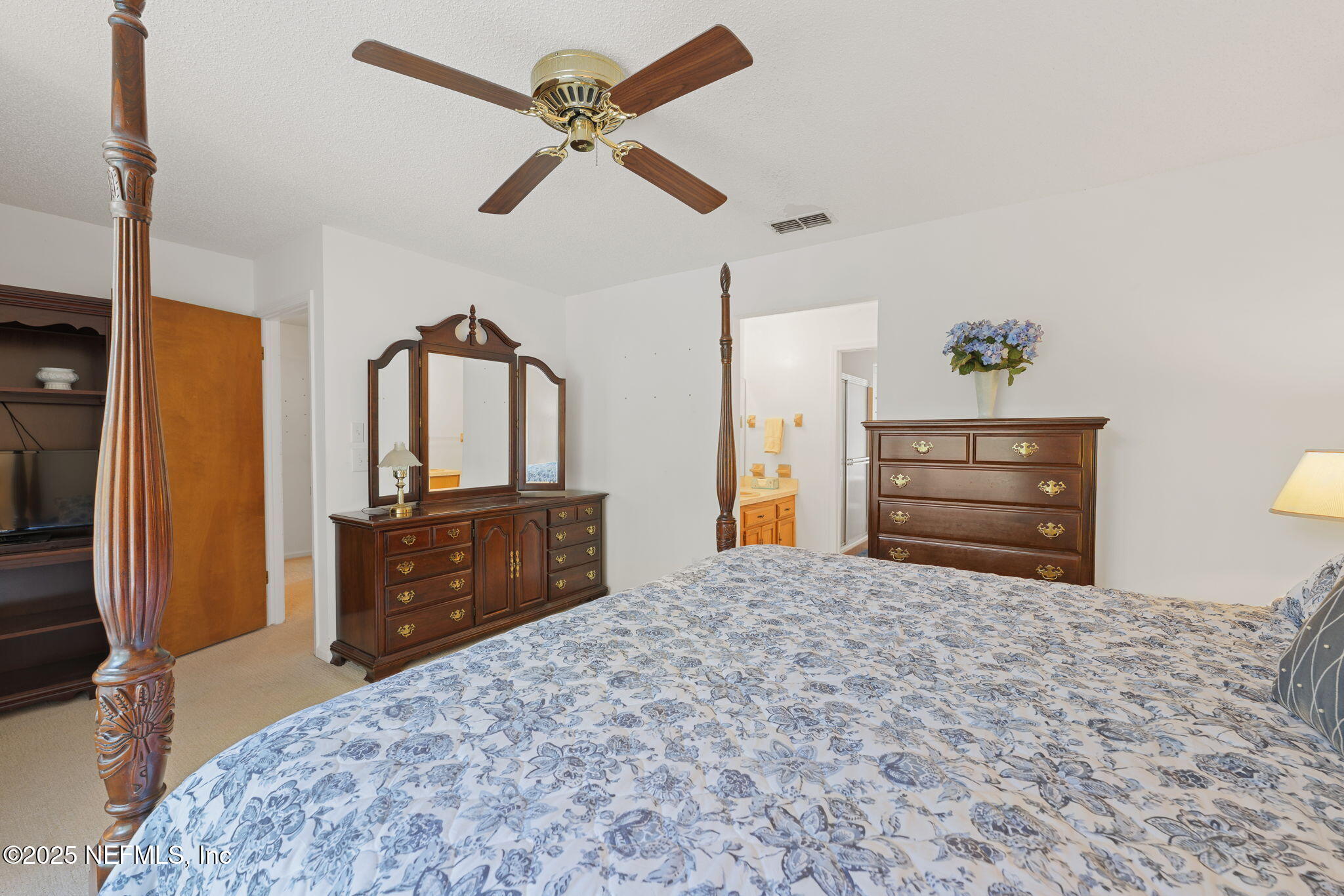 3007 Holly Road Orange Park, FL 32065 - Photo 25 of 44 a bedroom with a bed dresser and a dresser