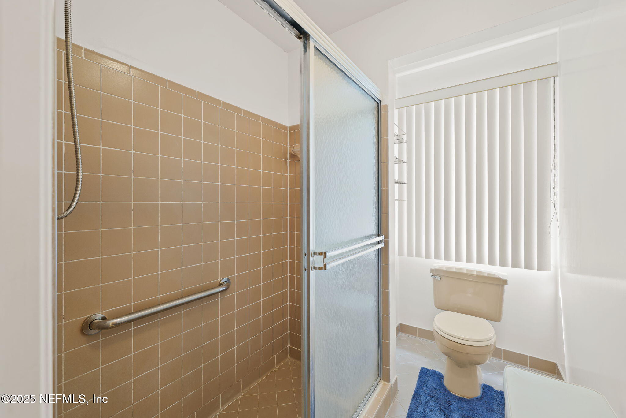 3007 Holly Road Orange Park, FL 32065 - Photo 27 of 44 a bathroom with a toilet and a shower