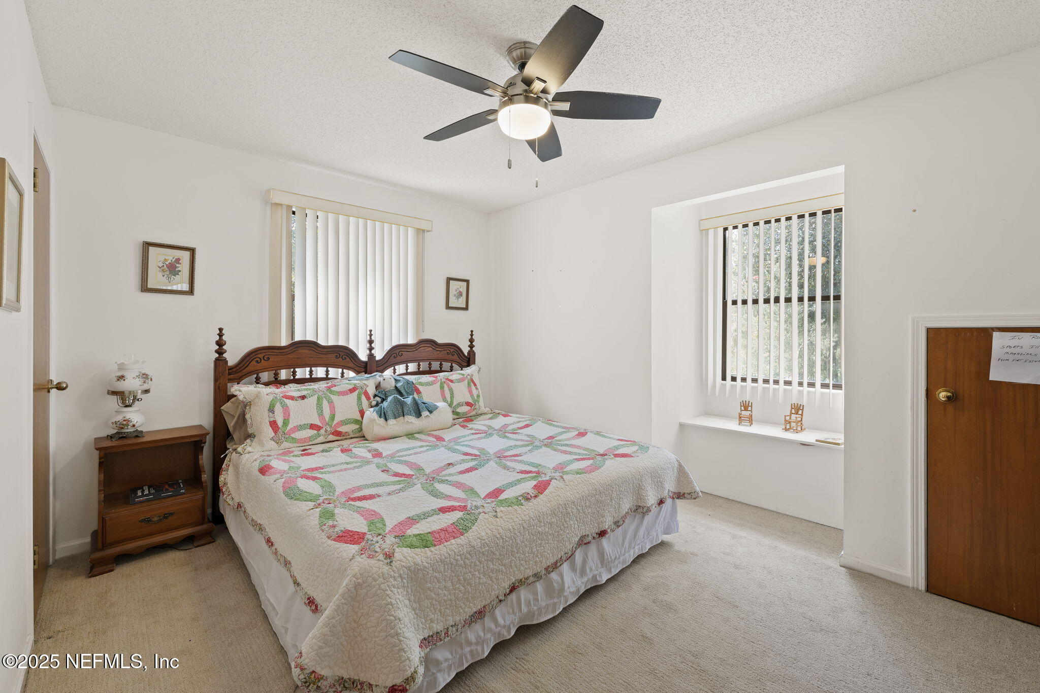 3007 Holly Road Orange Park, FL 32065 - Photo 28 of 44 a bedroom with a bed and a window