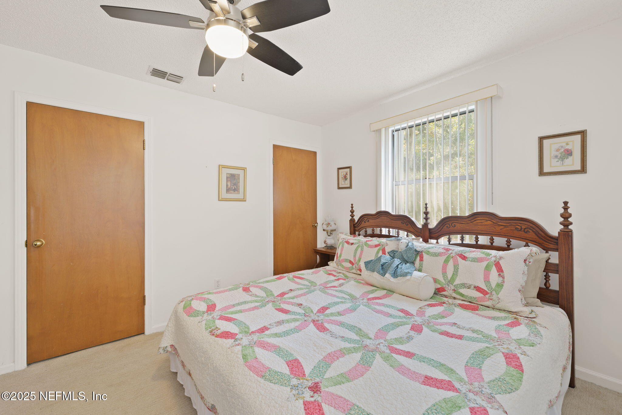 3007 Holly Road Orange Park, FL 32065 - Photo 29 of 44 a bedroom with a bed and window