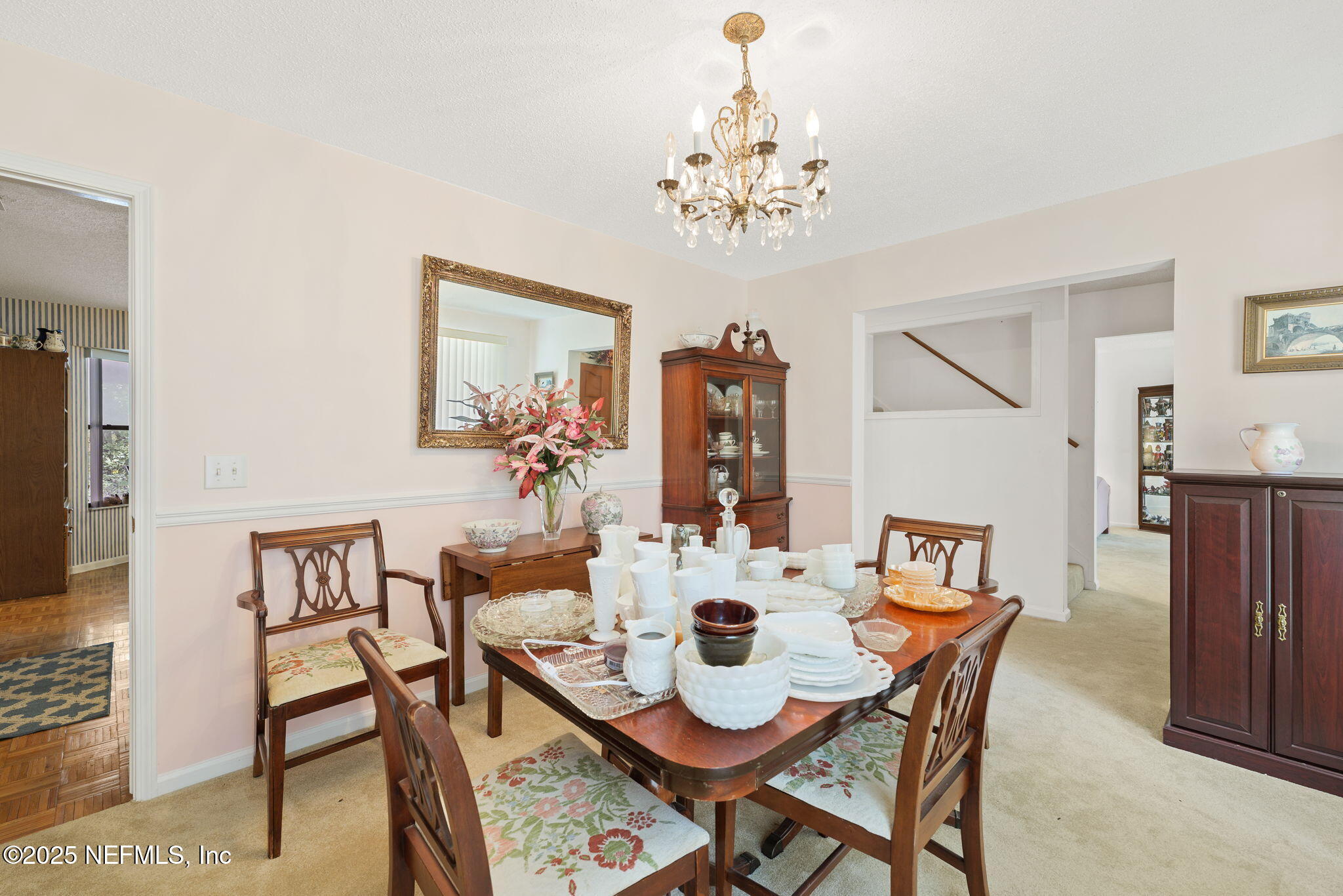 3007 Holly Road Orange Park, FL 32065 - Photo 7 of 44 a view of a dining room with furniture and chandelier