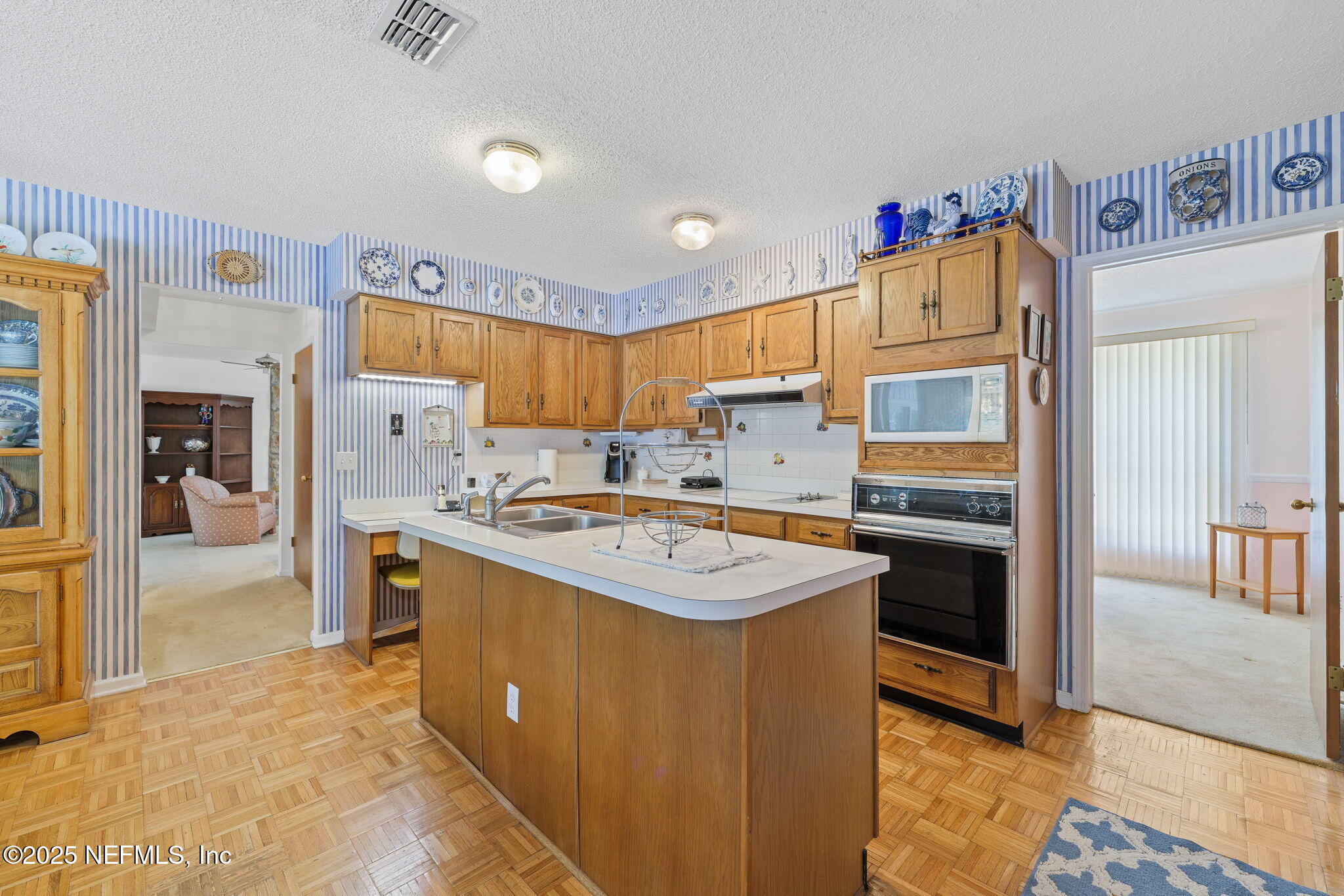 3007 Holly Road Orange Park, FL 32065 - Photo 9 of 44 a kitchen with a sink a stove and a refrigerator