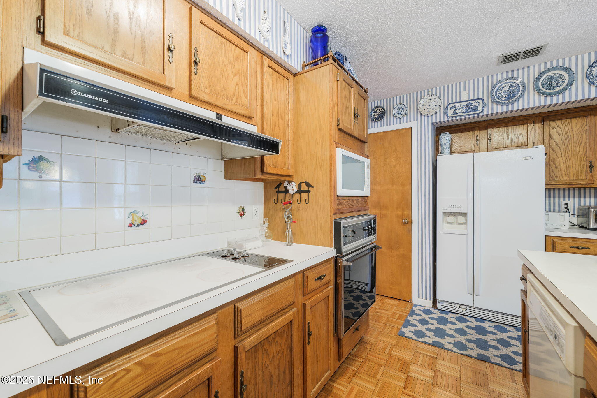 3007 Holly Road Orange Park, FL 32065 - Photo 10 of 44 a bathroom with a sink a mirror and a shower