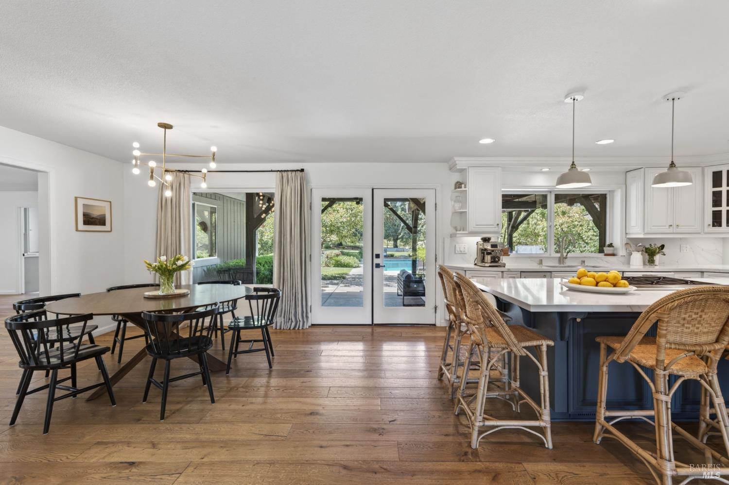 1541 Chablis Road Healdsburg, CA 95448 - Photo 20 of 68 a view of a dining area with furniture window and wooden floor