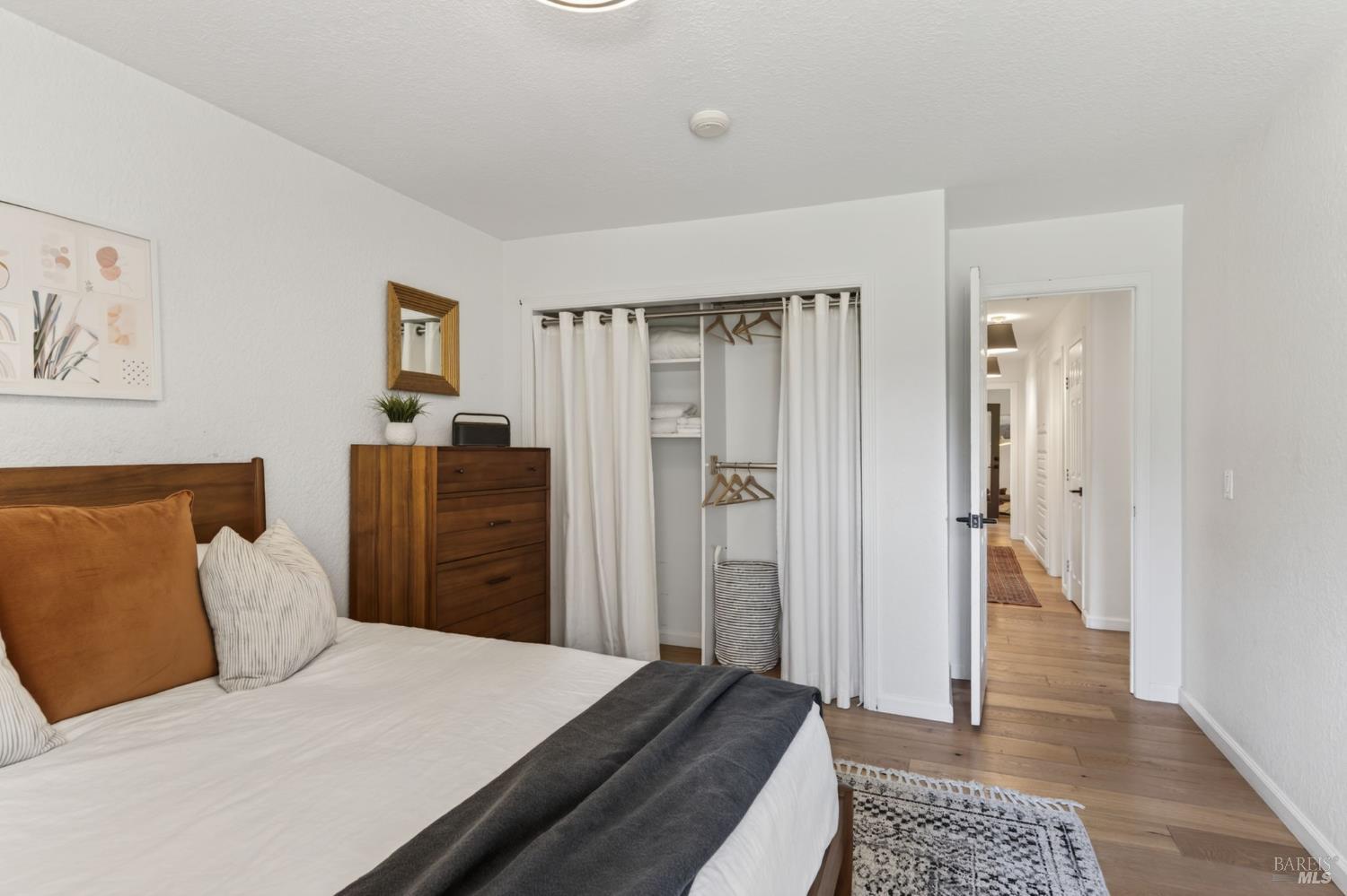 1541 Chablis Road Healdsburg, CA 95448 - Photo 31 of 68 a bedroom with a bed and wooden floor