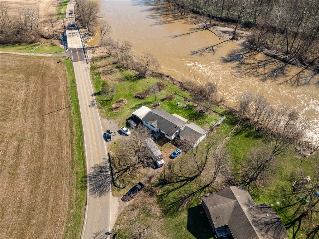 7315 Franklin-Trenton Road Franklin, OH 45005 - Photo 13 of 15 This captivating aerial view showcases a peaceful rural home nestled beside a flowing river.