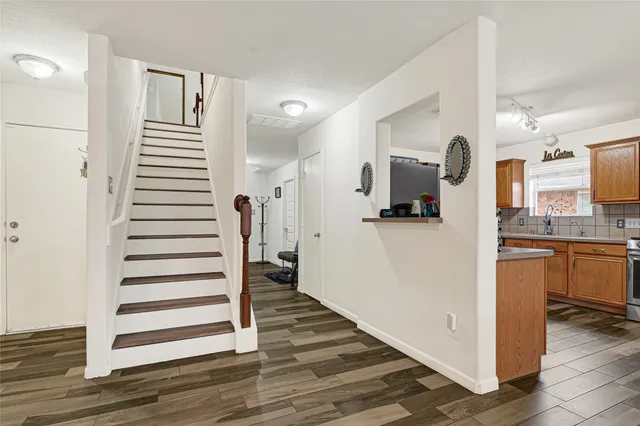 a view of entryway with wooden floor