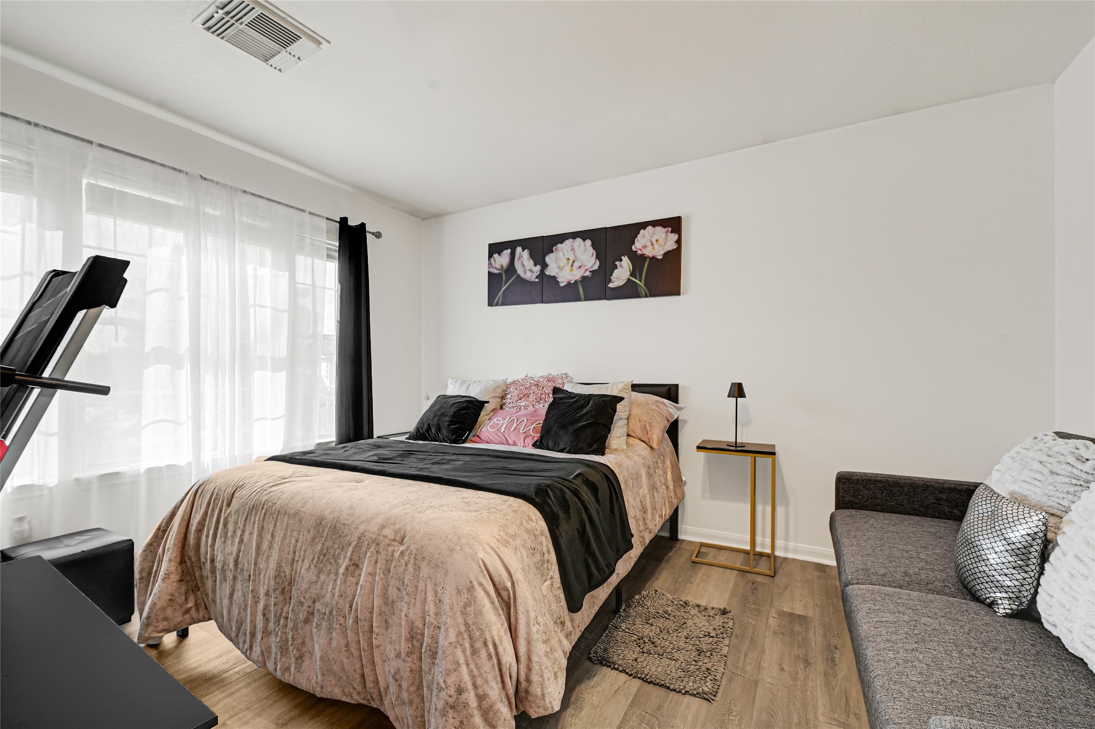 2527 Spring Lily Court Spring, TX 77373 - Photo 22 of 31 a bedroom with a bed and a window