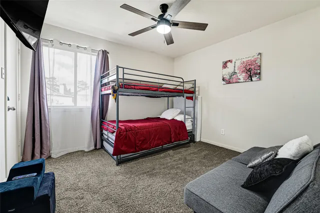 an outdoor space with swimming pool and furniture