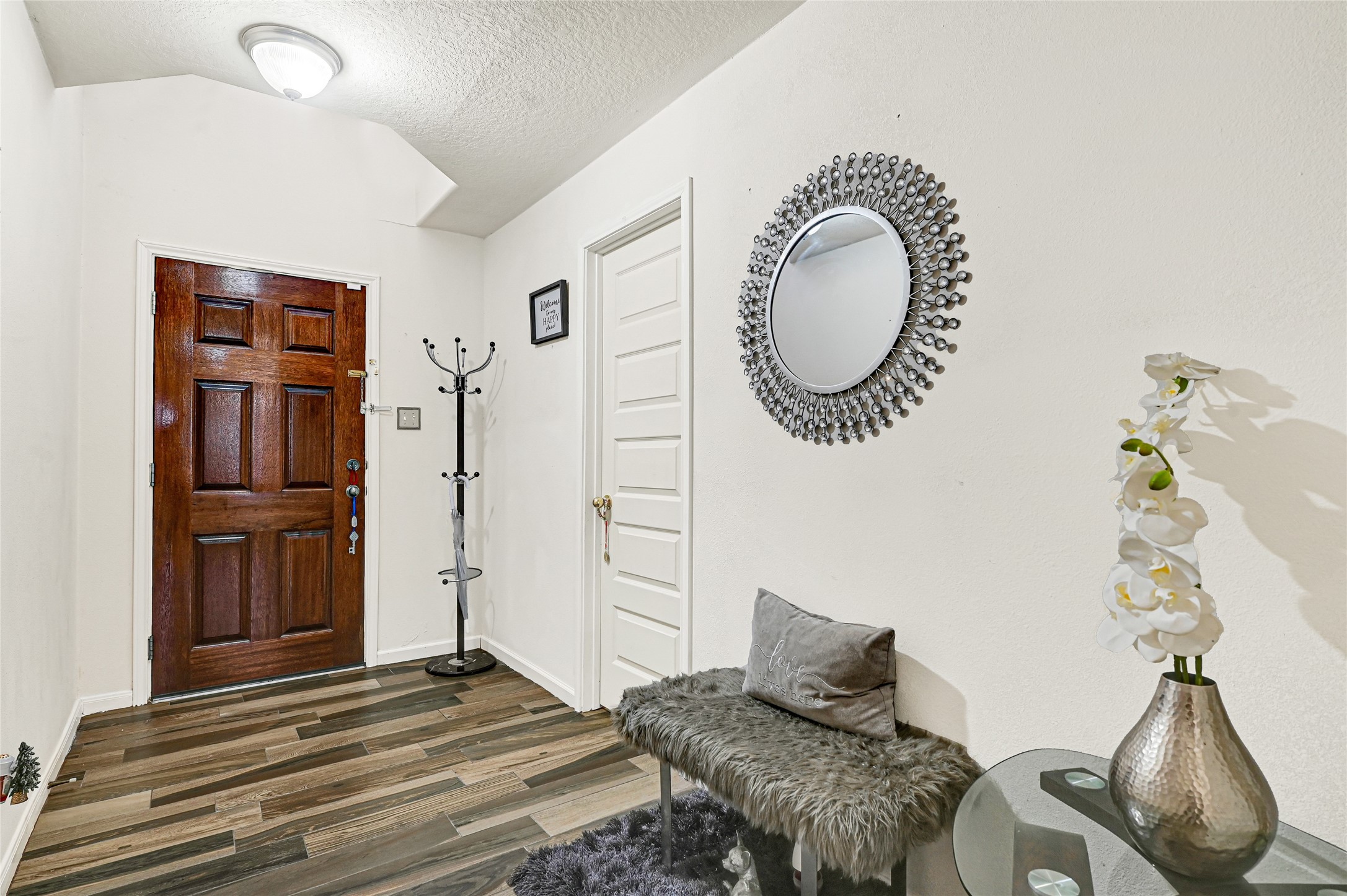 2527 Spring Lily Court Spring, TX 77373 - Photo 4 of 31 a bedroom with a bed and a chandelier