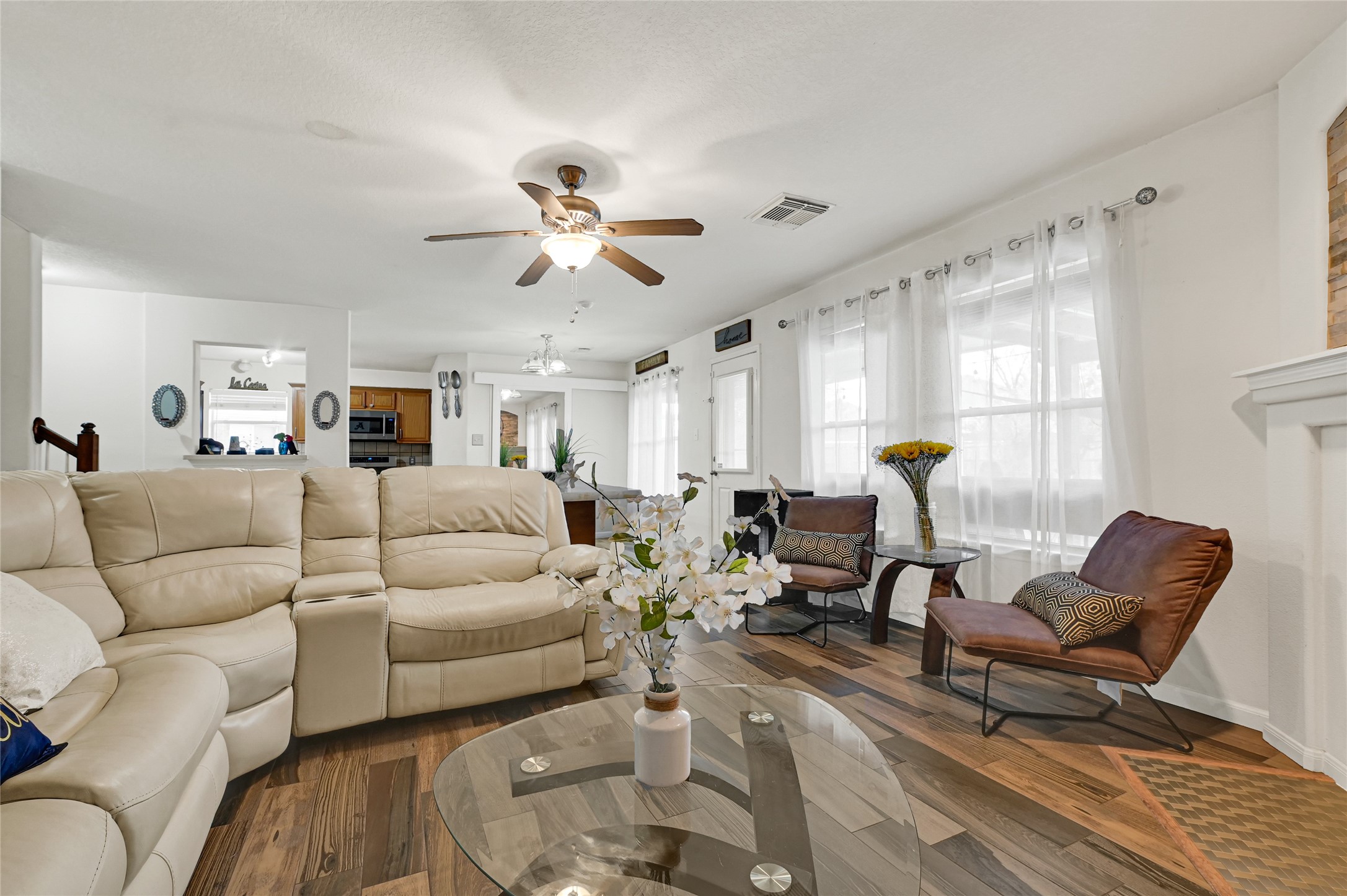 2527 Spring Lily Court Spring, TX 77373 - Photo 7 of 31 a living room with furniture a chandelier and a window