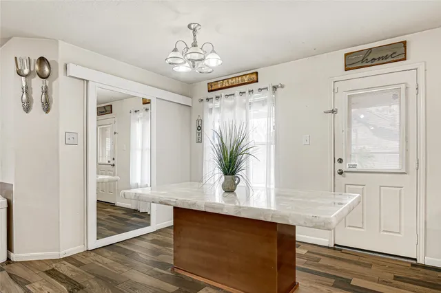 a utility room with dryer washer and other items