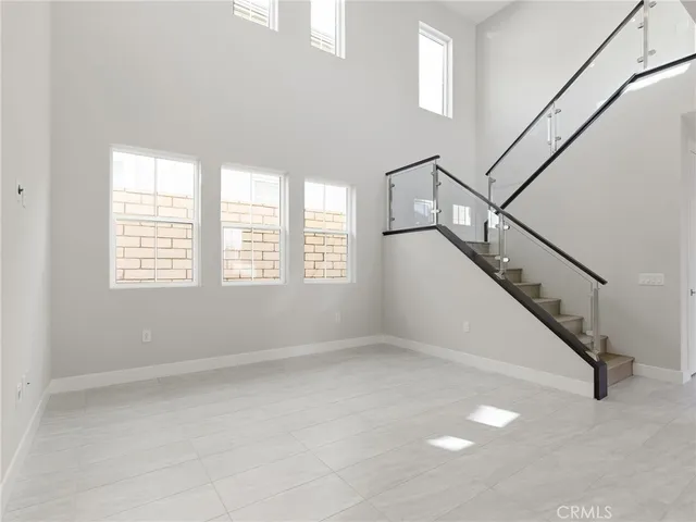 a view of entryway and hall with windows