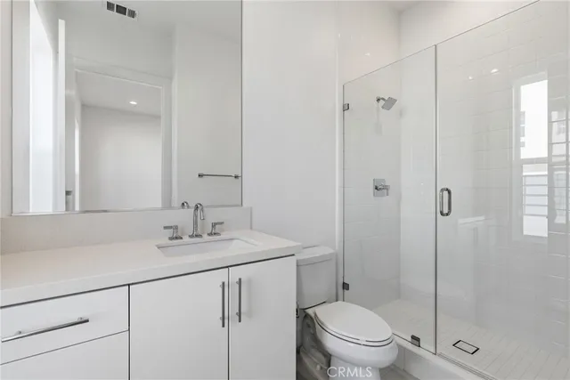 a view of a swimming pool with a table and chairs under an umbrella