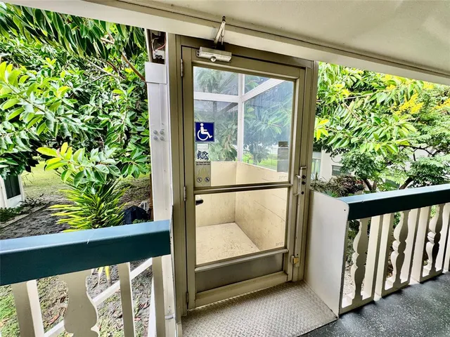 a view of a refrigerator and wooden floor