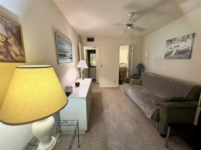 a view of a swimming pool with furniture