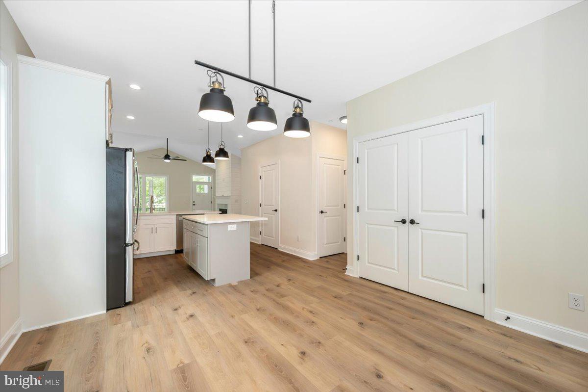 216 Brooks Lane St. Michaels, MD 21663 - Photo 11 of 37 a view of a room with wooden floor and windows