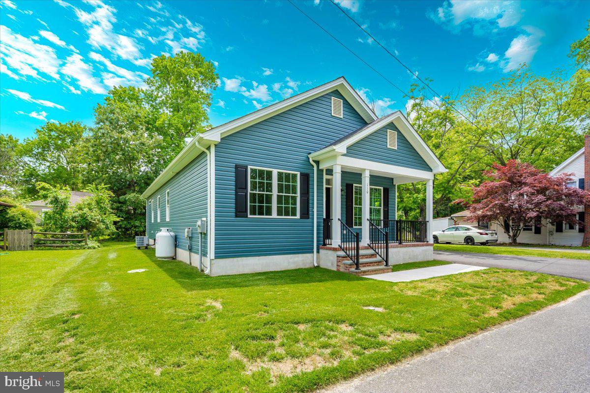 216 Brooks Lane St. Michaels, MD 21663 - Photo 2 of 37 a view of a house with a yard porch and sitting area