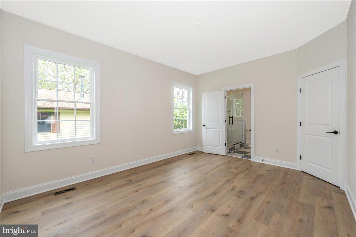 216 Brooks Lane St. Michaels, MD 21663 - Photo 22 of 37 an empty room with windows
