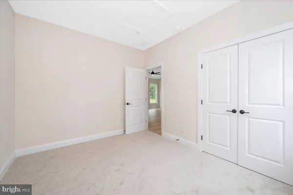 a bathroom with a granite countertop sink a toilet and bathtub