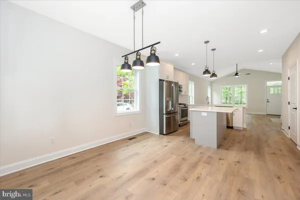 a view of a kitchen with a sink and a window
