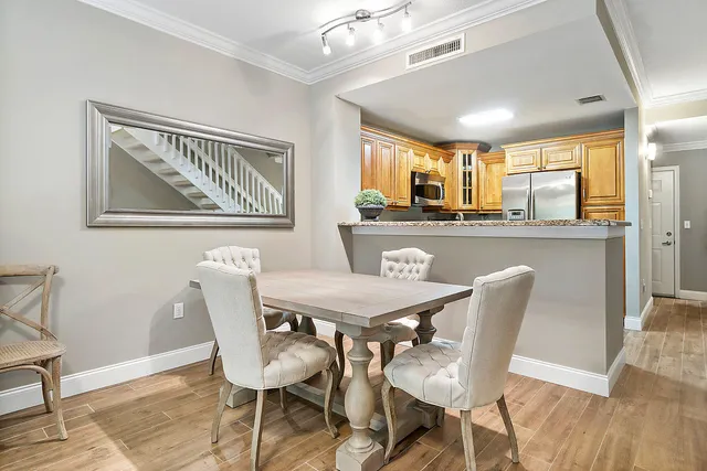 a dining room with furniture and window