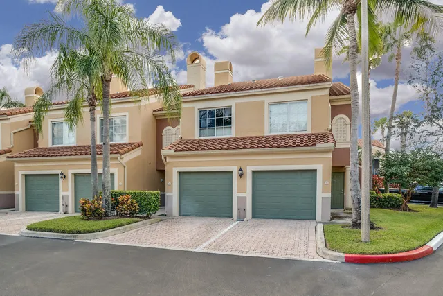 a view of a backyard with sitting area
