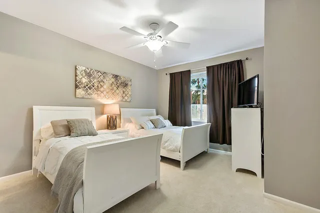 a bed room with a bed and a chandelier