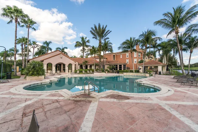 a view of house with outdoor space and swimming pool