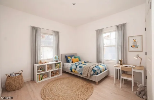 a bedroom with a bed and a chair