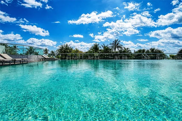 a view of a garden with lawn chairs