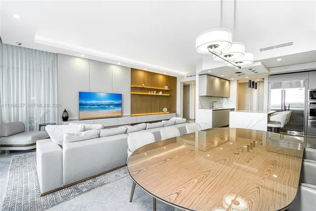 a living room with fireplace furniture and a flat screen tv