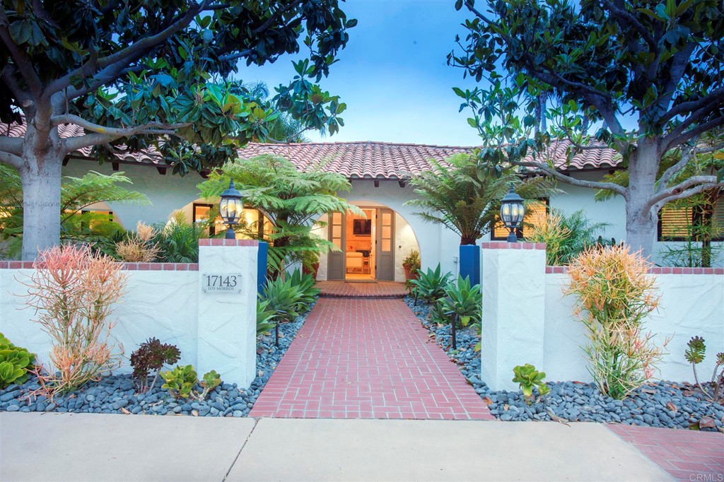 The front courtyard has beautiful magnolia trees and two fountains that welcome you to the home.