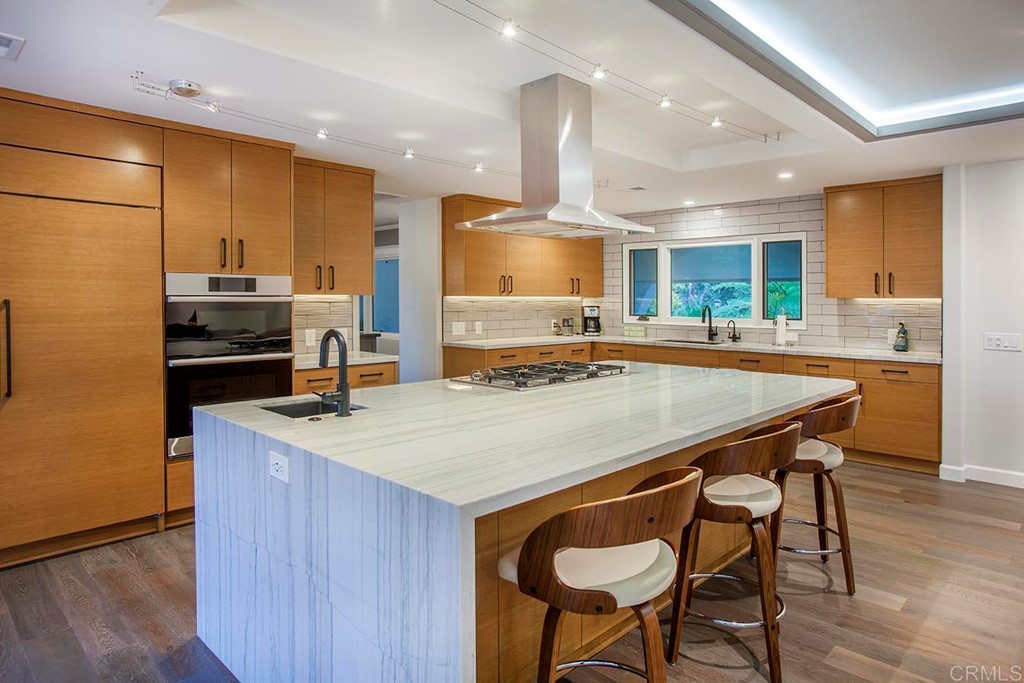 17143 Los Morros Rancho Santa Fe, CA 92067 - Photo 11 of 32 Modern kitchen with waterfall island and custom cabinetry. Plenty of room to have many together.