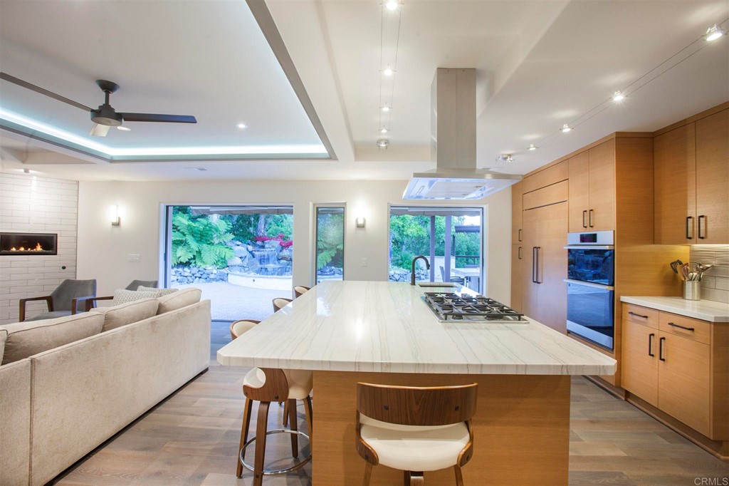 17143 Los Morros Rancho Santa Fe, CA 92067 - Photo 12 of 32 Center island has plenty of seating for in kitchen eating.