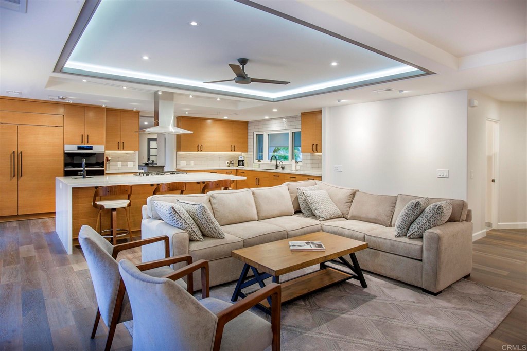 17143 Los Morros Rancho Santa Fe, CA 92067 - Photo 14 of 32 Spacious family room with fireplace. Soffit lighting creates a relaxing space to gather.