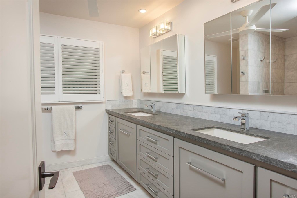 17143 Los Morros Rancho Santa Fe, CA 92067 - Photo 24 of 32 Second full bathroom with dual sinks and walk-in shower.