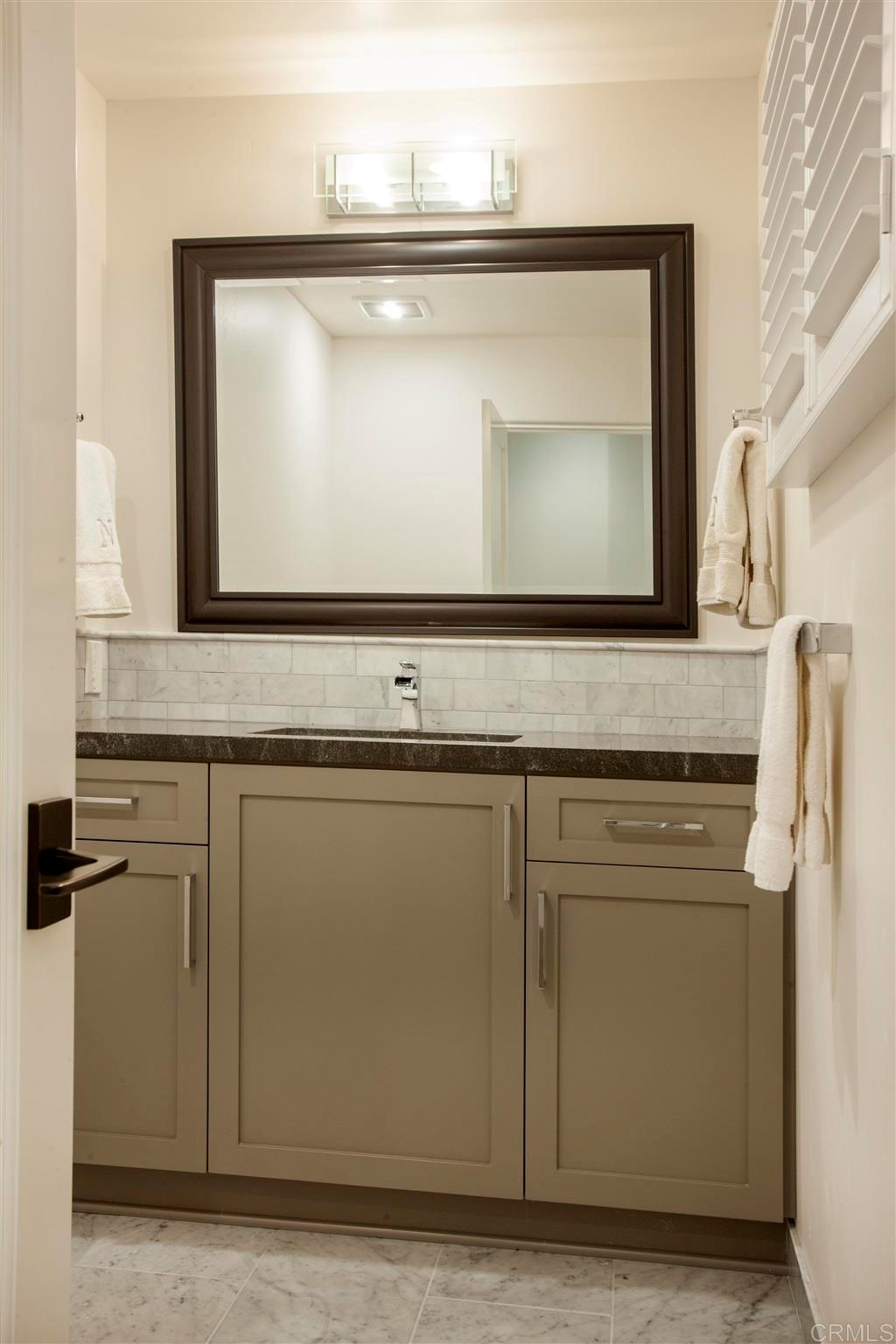 17143 Los Morros Rancho Santa Fe, CA 92067 - Photo 27 of 32 Powder room close to garage and family room.