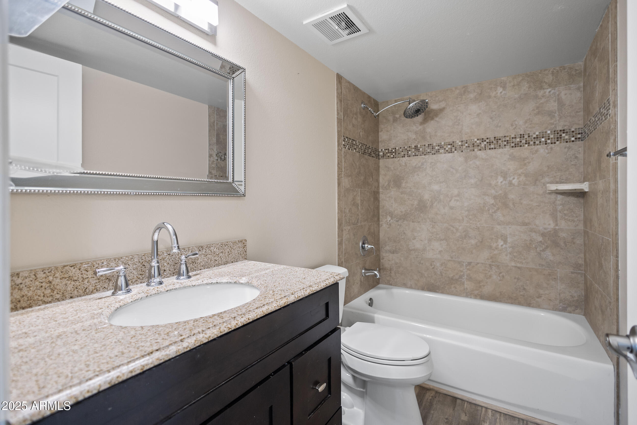 7920 East Camelback Road, Unit 601 Scottsdale, AZ 85251 - Photo 12 of 35 a bathroom with a granite countertop sink toilet and shower