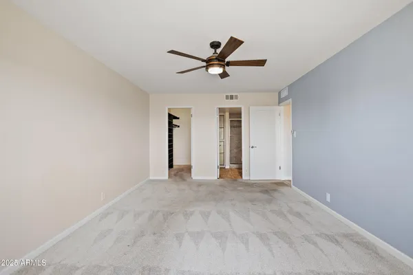 a dining room with furniture and a kitchen view
