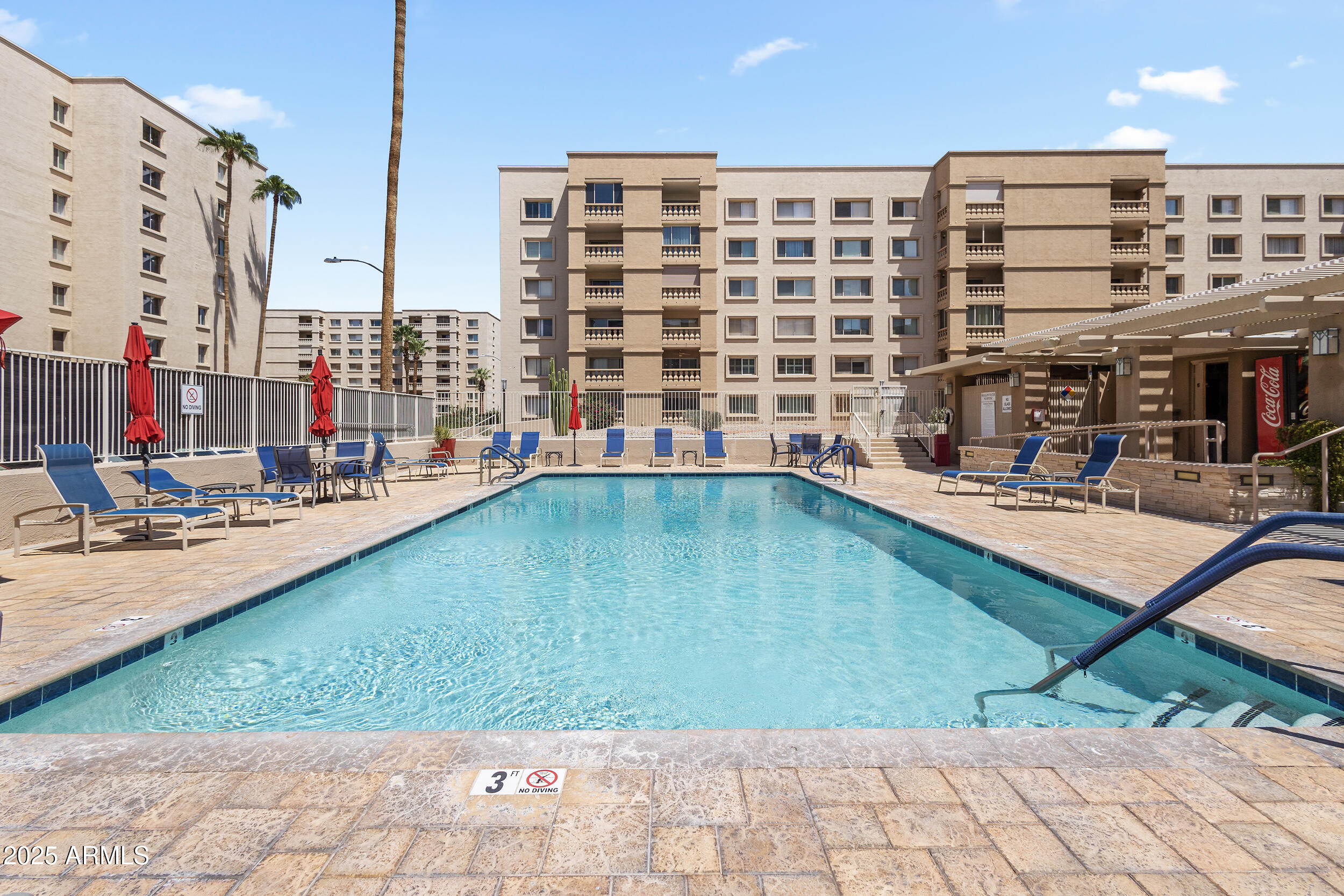 7920 East Camelback Road, Unit 601 Scottsdale, AZ 85251 - Photo 18 of 31 a view of swimming pool with outdoor seating