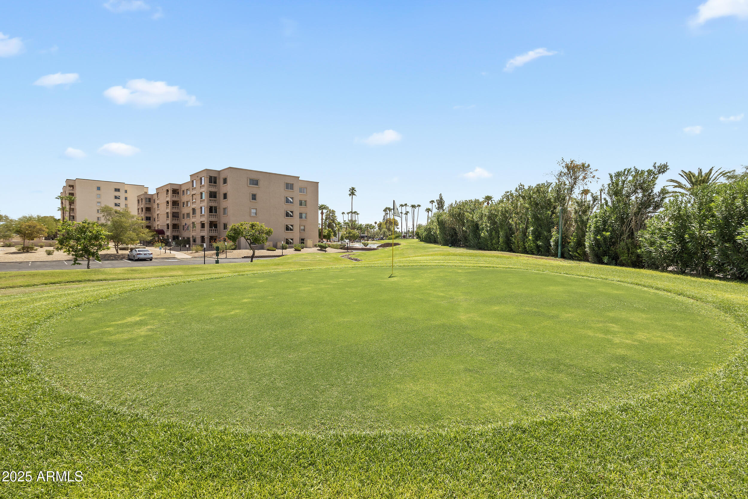7920 East Camelback Road, Unit 601 Scottsdale, AZ 85251 - Photo 26 of 35 a view of a building with an outdoor space and seating