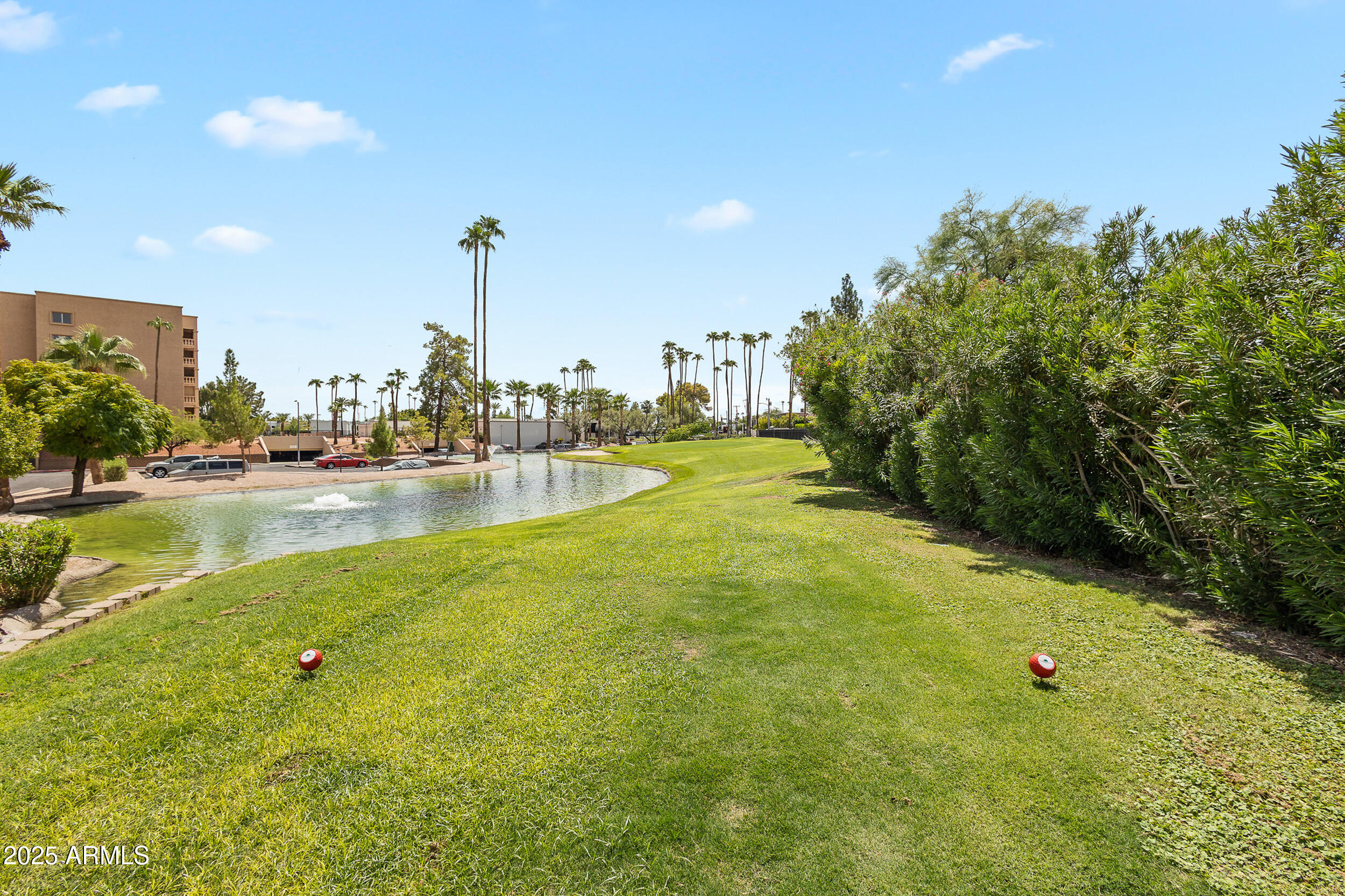 7920 East Camelback Road, Unit 601 Scottsdale, AZ 85251 - Photo 27 of 35 a view of a water fountain and a big yard
