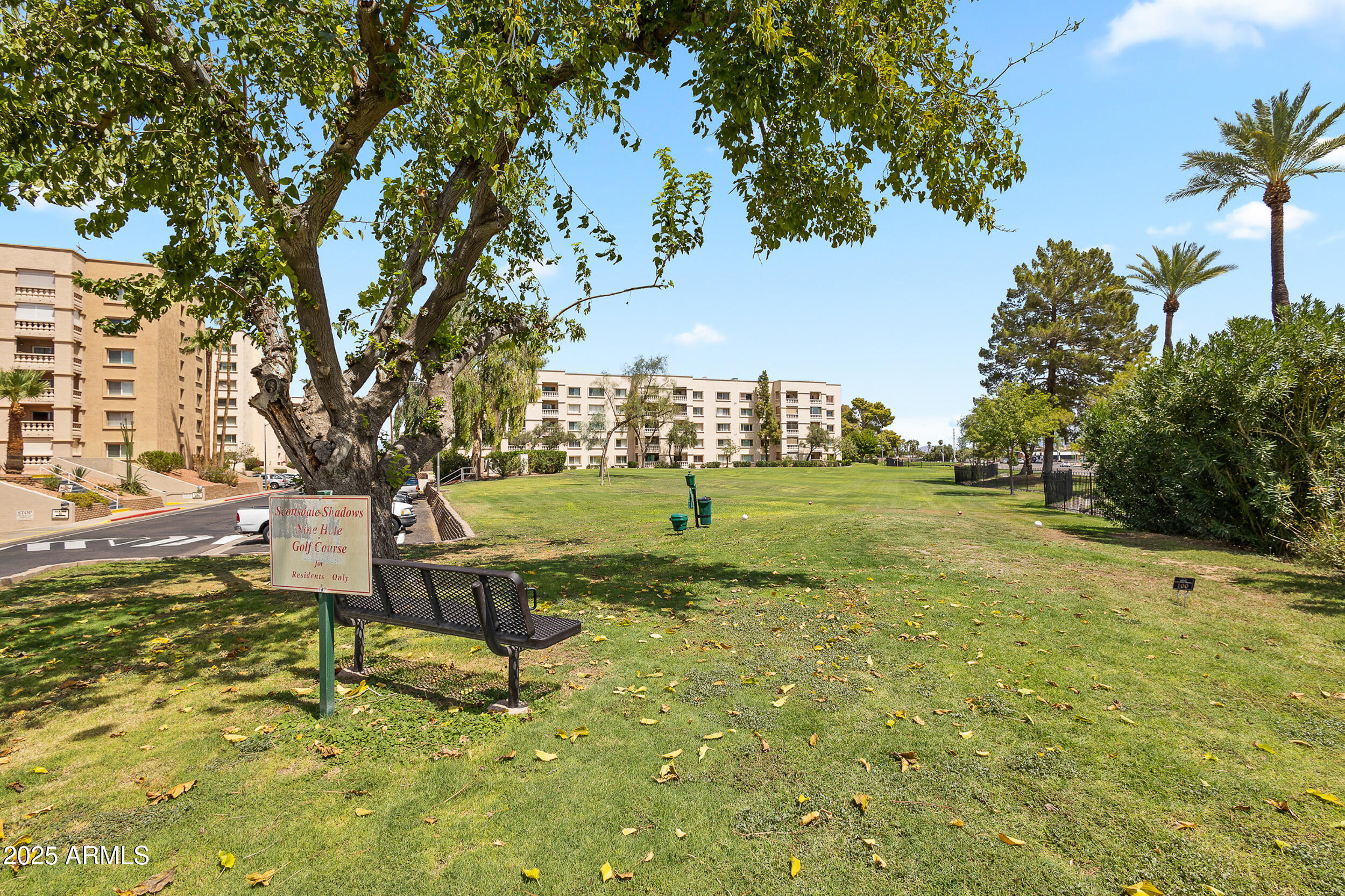 7920 East Camelback Road, Unit 601 Scottsdale, AZ 85251 - Photo 30 of 35 a view of a playground with a tree