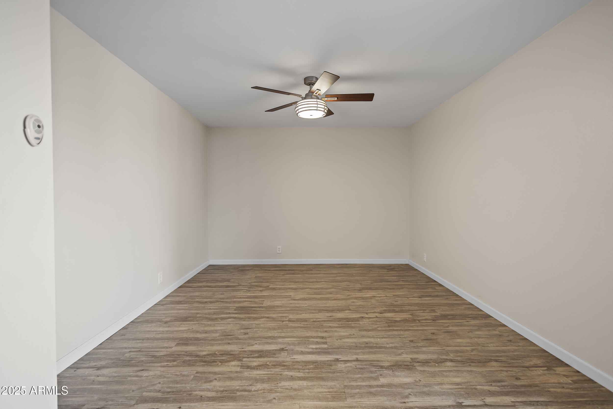 7920 East Camelback Road, Unit 601 Scottsdale, AZ 85251 - Photo 6 of 31 an empty room with a window and ceiling fan