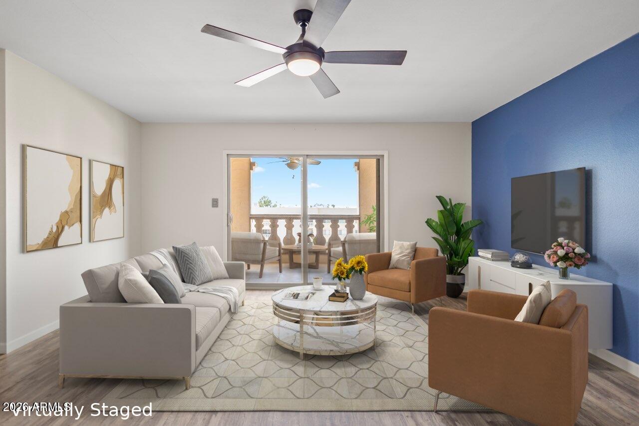 7920 East Camelback Road, Unit 601 Scottsdale, AZ 85251 - Photo 9 of 35 a living room with furniture and a large window
