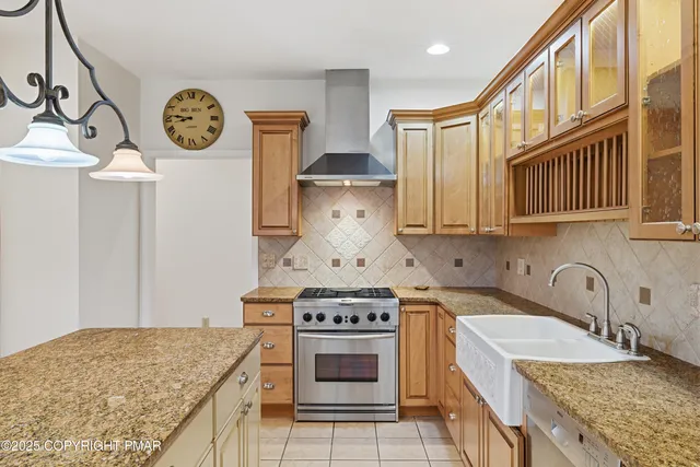 a kitchen with a stove and a sink
