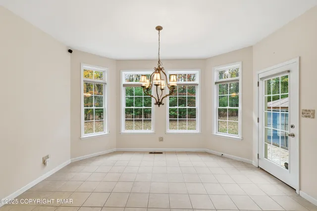 a view of an empty room with windows